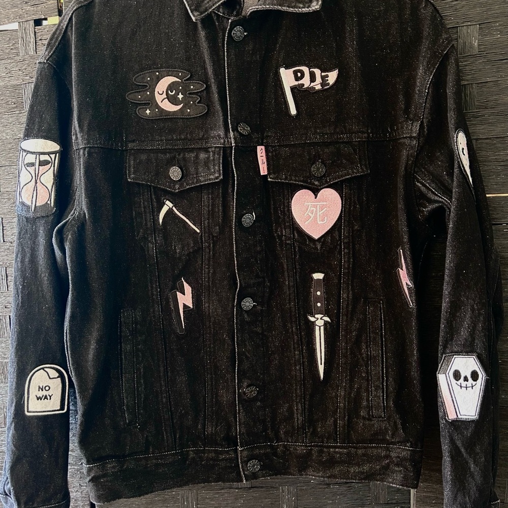 Edgy Black Denim Jacket with Unique Patches